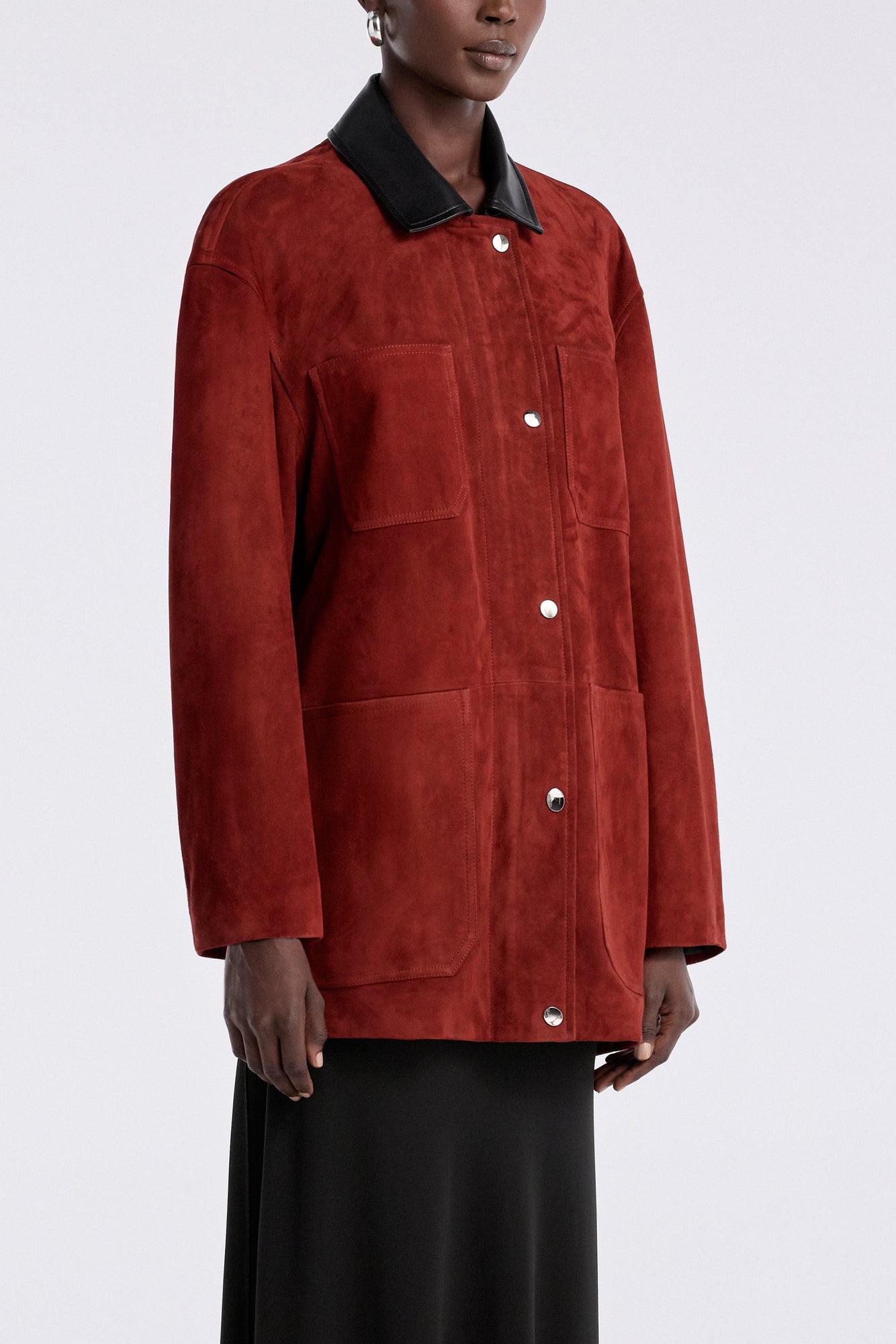 Model is wearing the Nour Hammour Barn Modern Suede Jacket Rouge - Three Quarters