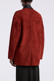 Model is wearing the Nour Hammour Barn Modern Suede Jacket Rouge - Back