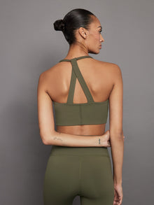 Back view of olive Diamond Compression T Back Bra showing racerback straps.