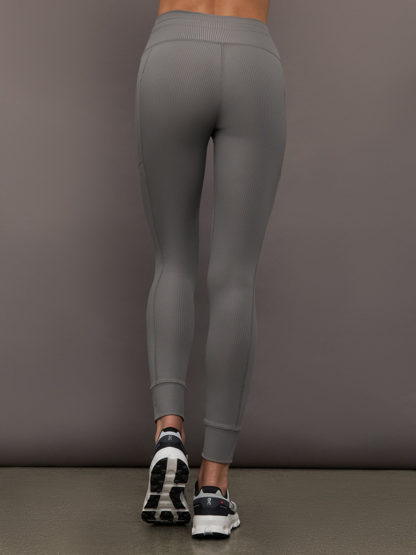 Back view of Ribbed Melt High Rise Legging in Steel Grey on model.