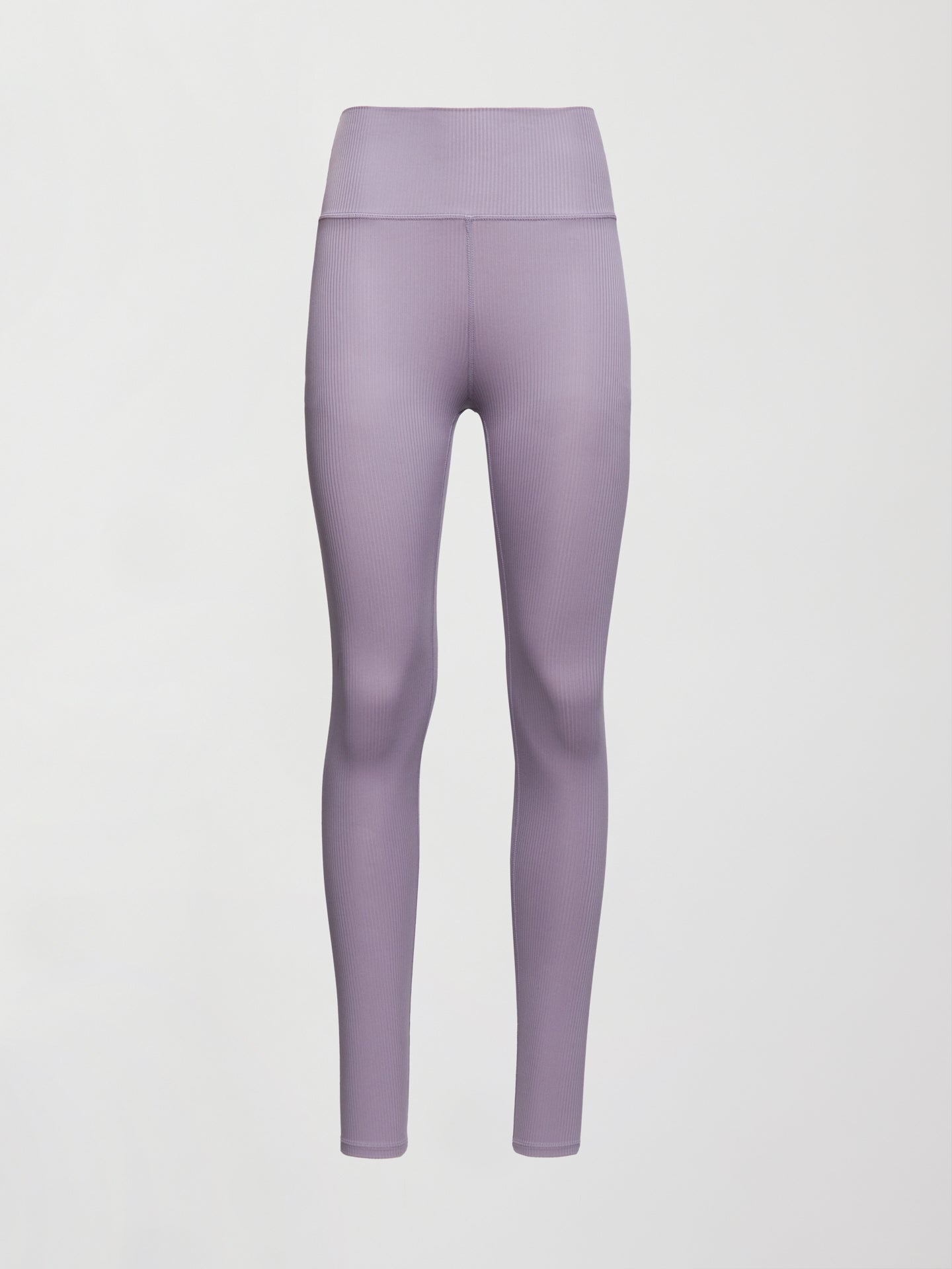 Model wears lavender grey, high-rise ribbed leggings with a fitted, full-length silhouette.
