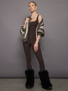 Styled look of Melt wide scoop bra tank in Dark Oak with striped knit cardigan and leggings.