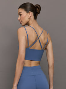 Back view of Blue Horizon strappy sports bra with crisscross strap detail.