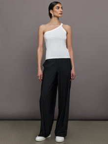 Model wears a white ribbed one shoulder tank.