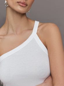 Model wears a white ribbed one shoulder tank.