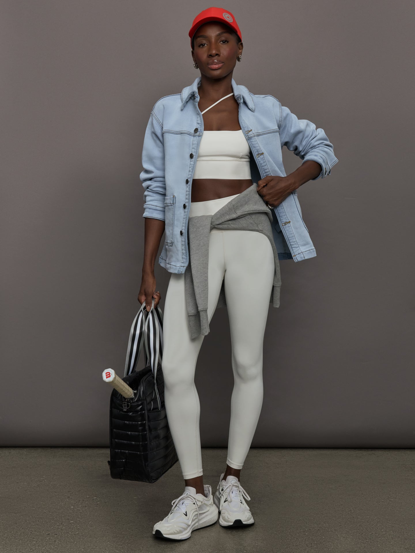Model wears a light washed denim shirt jacket.