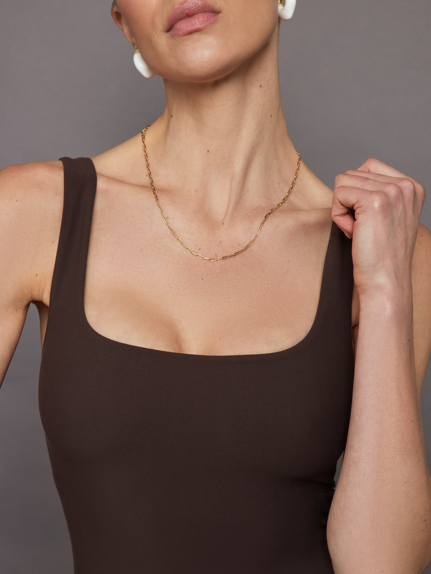 Close-up neckline detail of Melt wide scoop bra tank in Dark Oak.