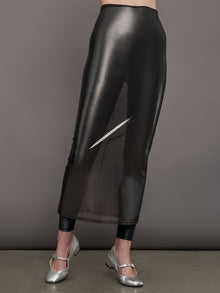 Model wears a silver-grey, semi-sheer mesh skirt with an elastic waistband.