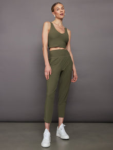 Model wearing Melt cropped jogger with tulip hem in olive, full outfit front view.