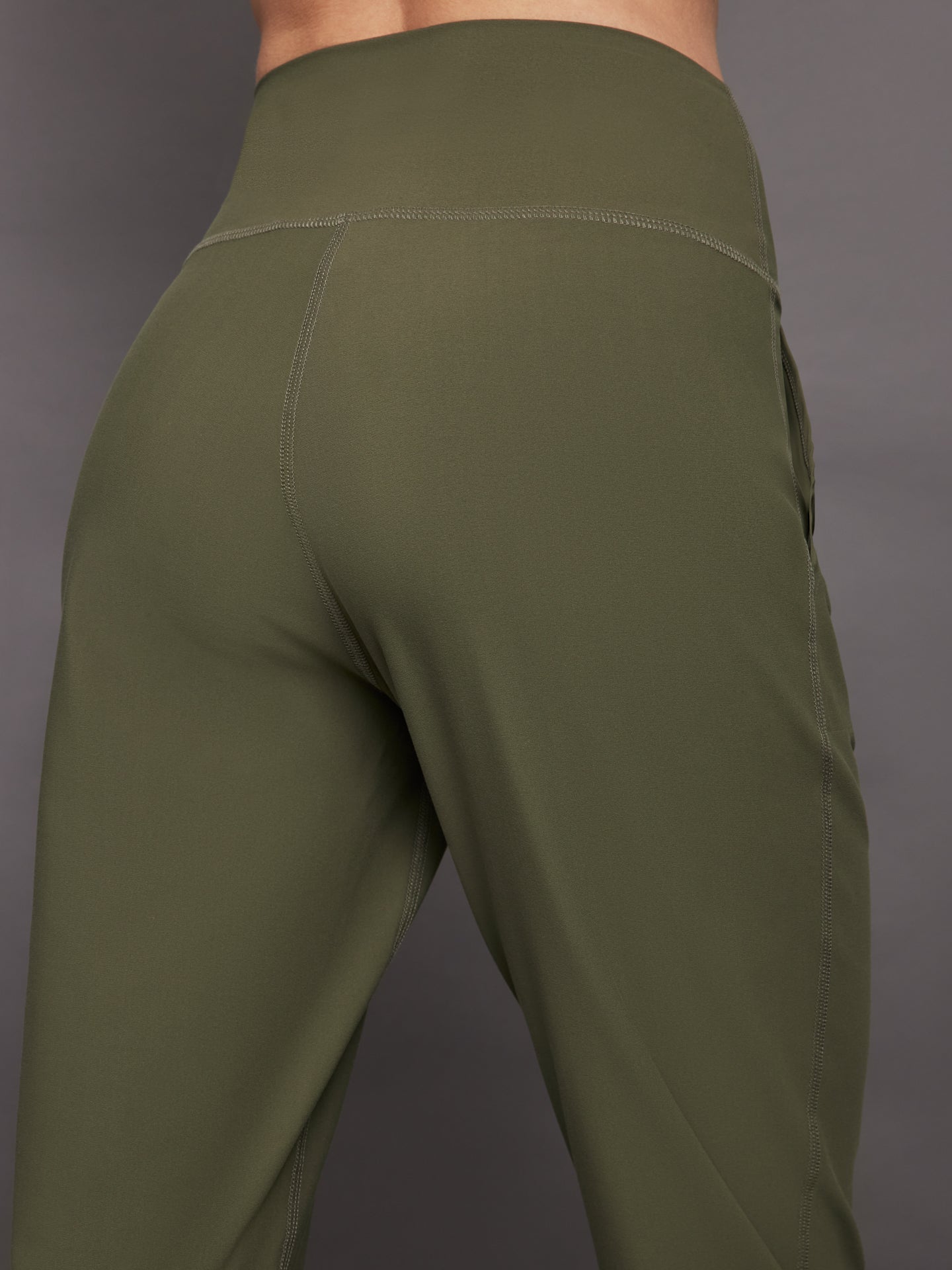 Close-up of Melt cropped jogger waistband and seam in olive.