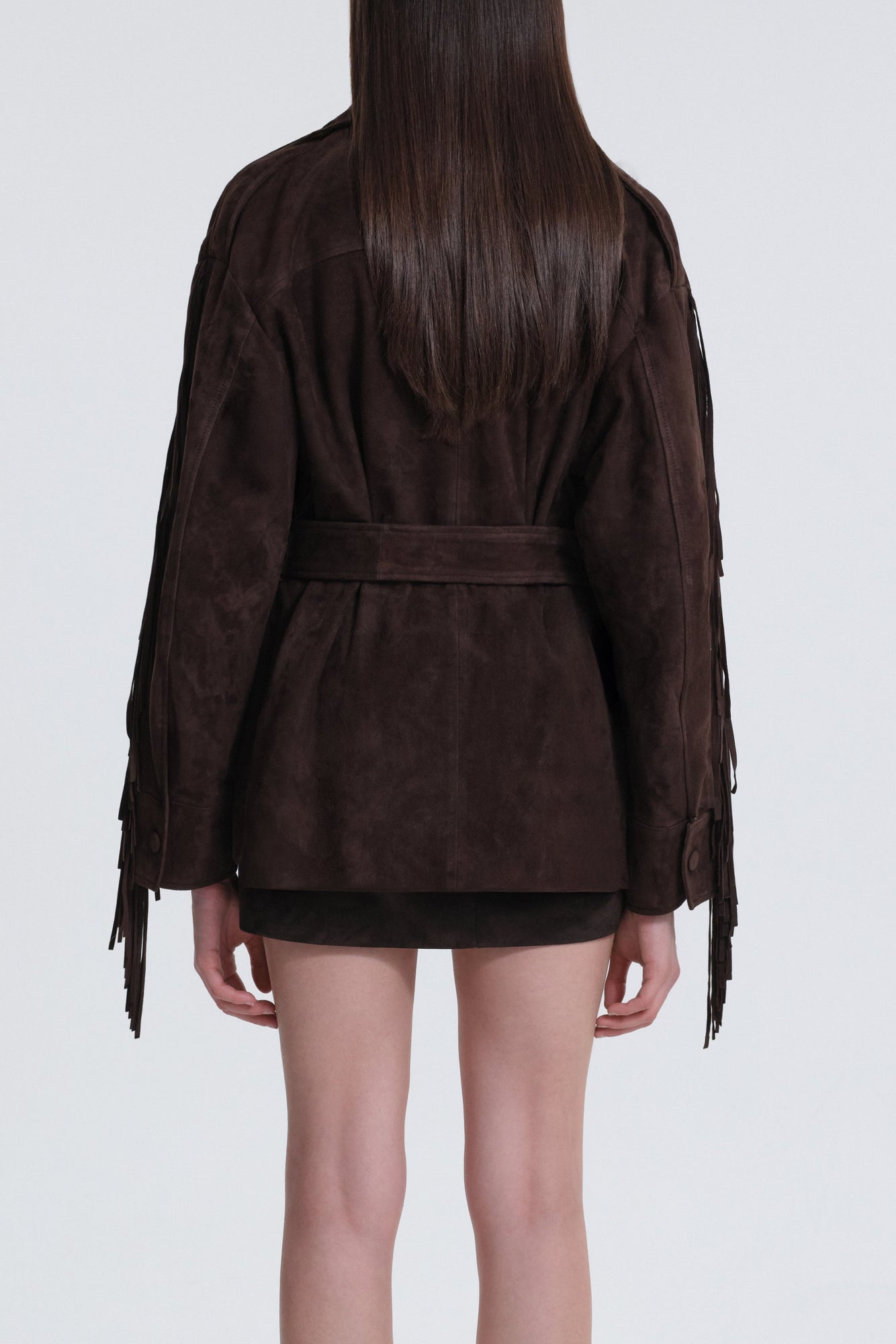 Model is wearing Nour Hammour Cassidy Oversized Suede Fringe Jacket Mocha - Back
