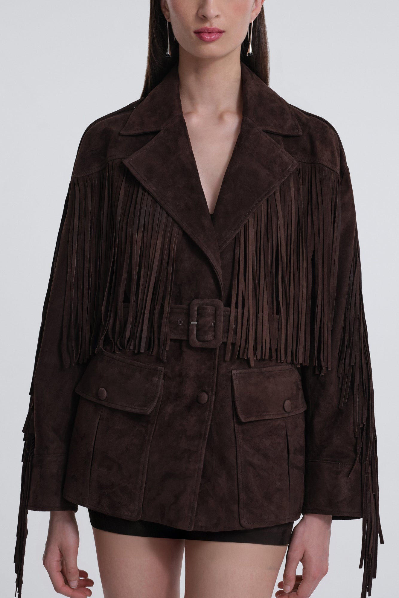 Model is wearing Nour Hammour Cassidy Oversized Suede Fringe Jacket Mocha - Front