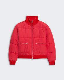 Women's chili red quilted puffer jacket with ribbed collar, hem, cuffs, and front zipper closure.