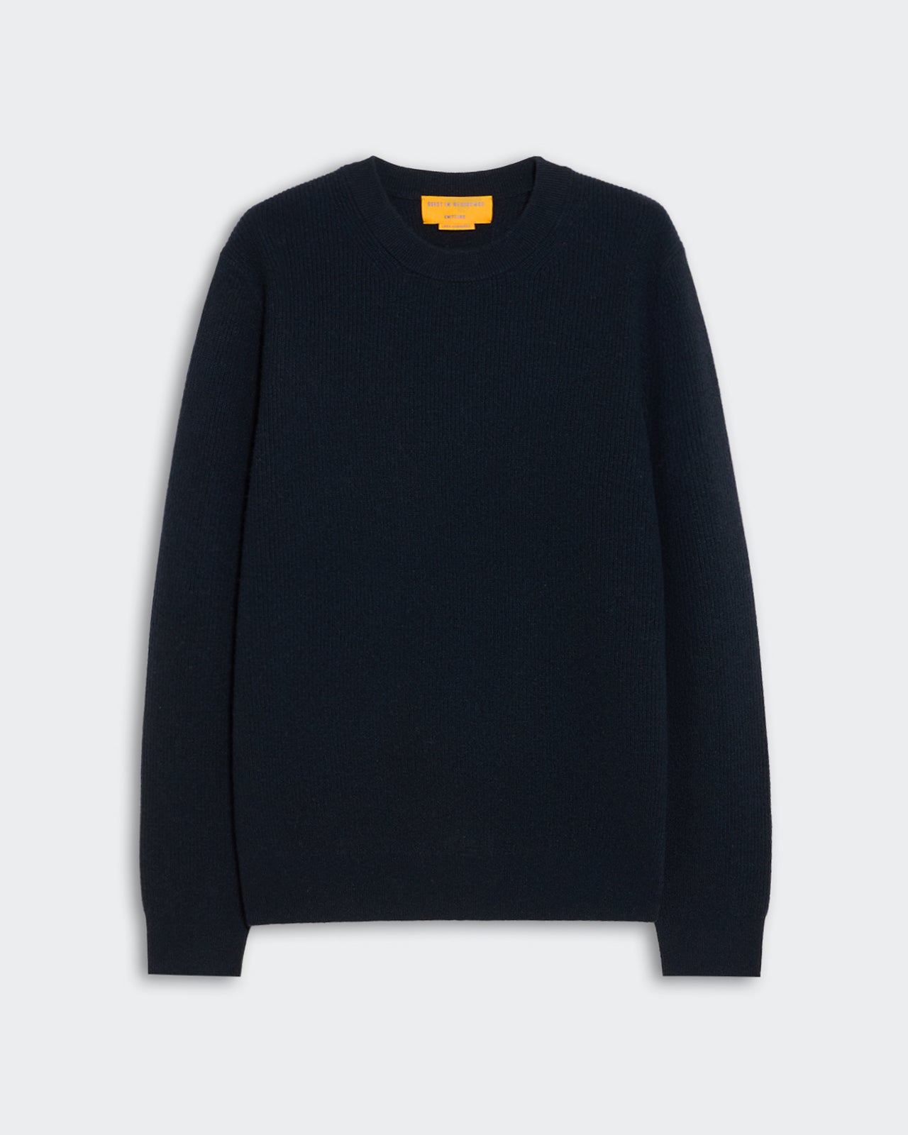 Dark navy blue crewneck sweater laid flat against a light background featuring a ribbed knit texture labeled Rib Allday Crew - Midnight.