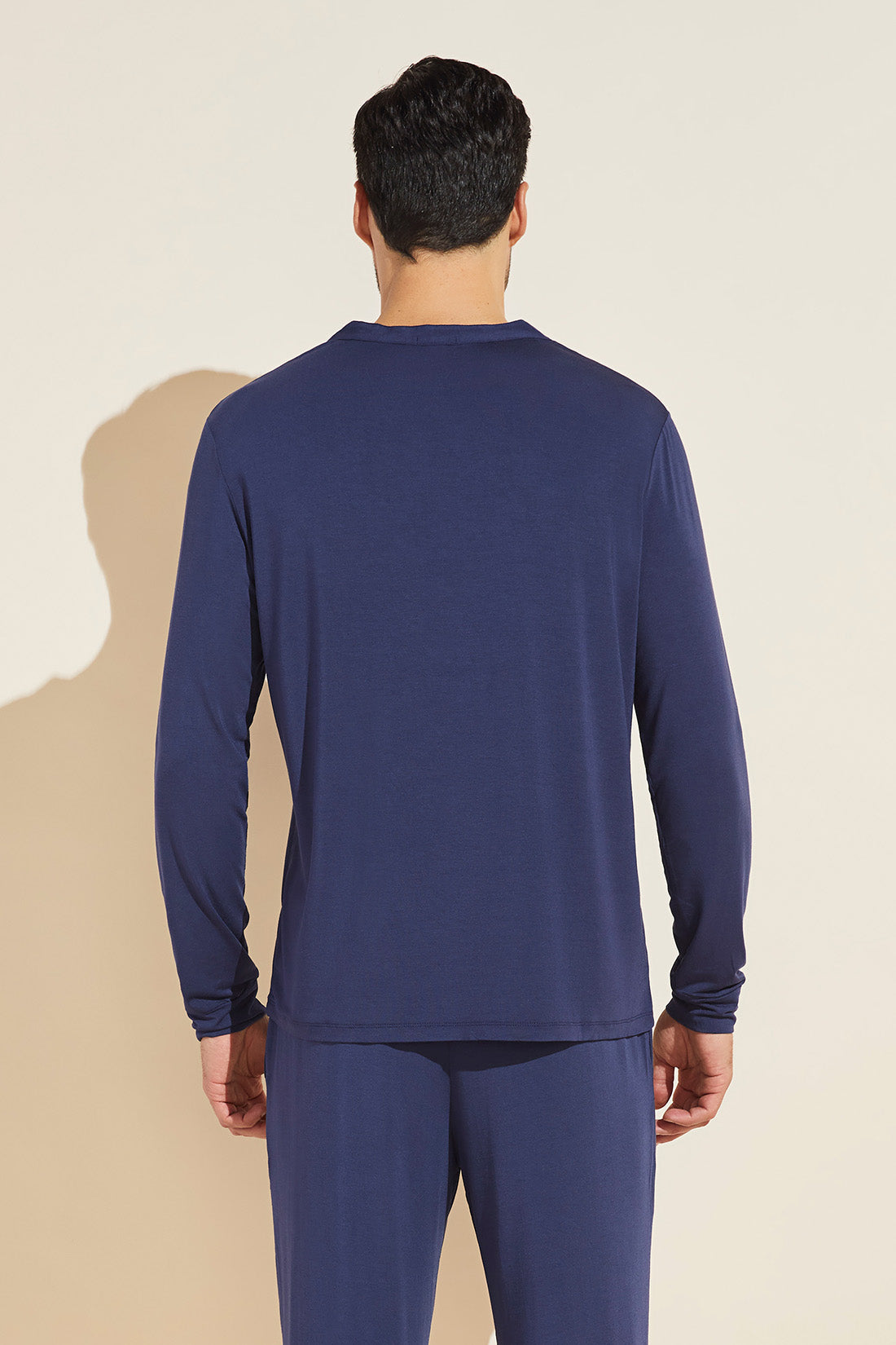 Model wears Henry TENCEL™ Modal Long Sleeve Henley in true navy.