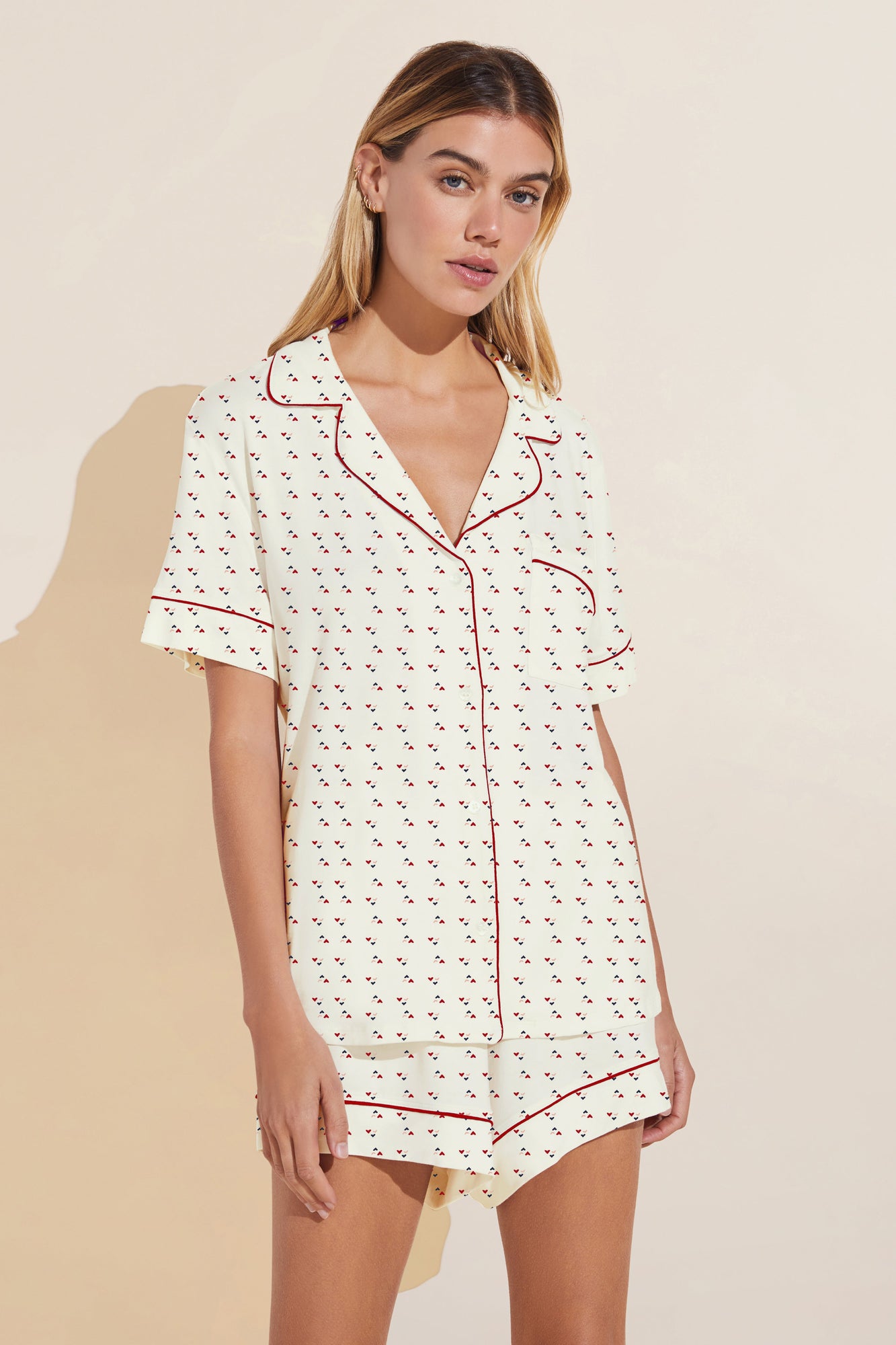 Model wears Gisele Printed TENCEL™ Modal Relaxed Short PJ Set in triple heart print/haute red.