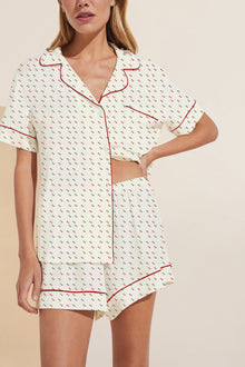 Model wears Gisele Printed TENCEL™ Modal Relaxed Short PJ Set in triple heart print/haute red.