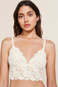 Model wears Naya Longline Bralette in ivory.