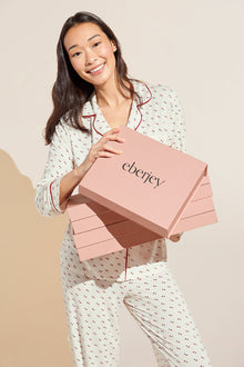 Model wears Gisele Printed TENCEL™ Modal Long PJ Set in triple heart print.