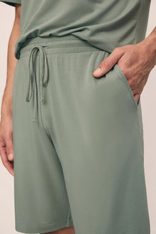 Model is wearing Henry TENCEL Modal TENCEL Modal Short PJ Set in Eucalyptus