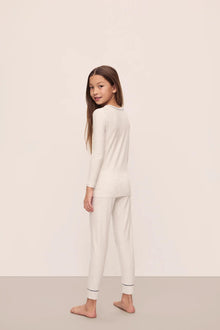 Model is wearing Kids Printed TENCEL Modal Unisex Long PJ Set in Heritage Stripe Light Heather Grey/Peppercorn