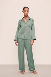 Model is wearing Inez Washable Silk Long PJ Set in Eucalyptus/Ivory