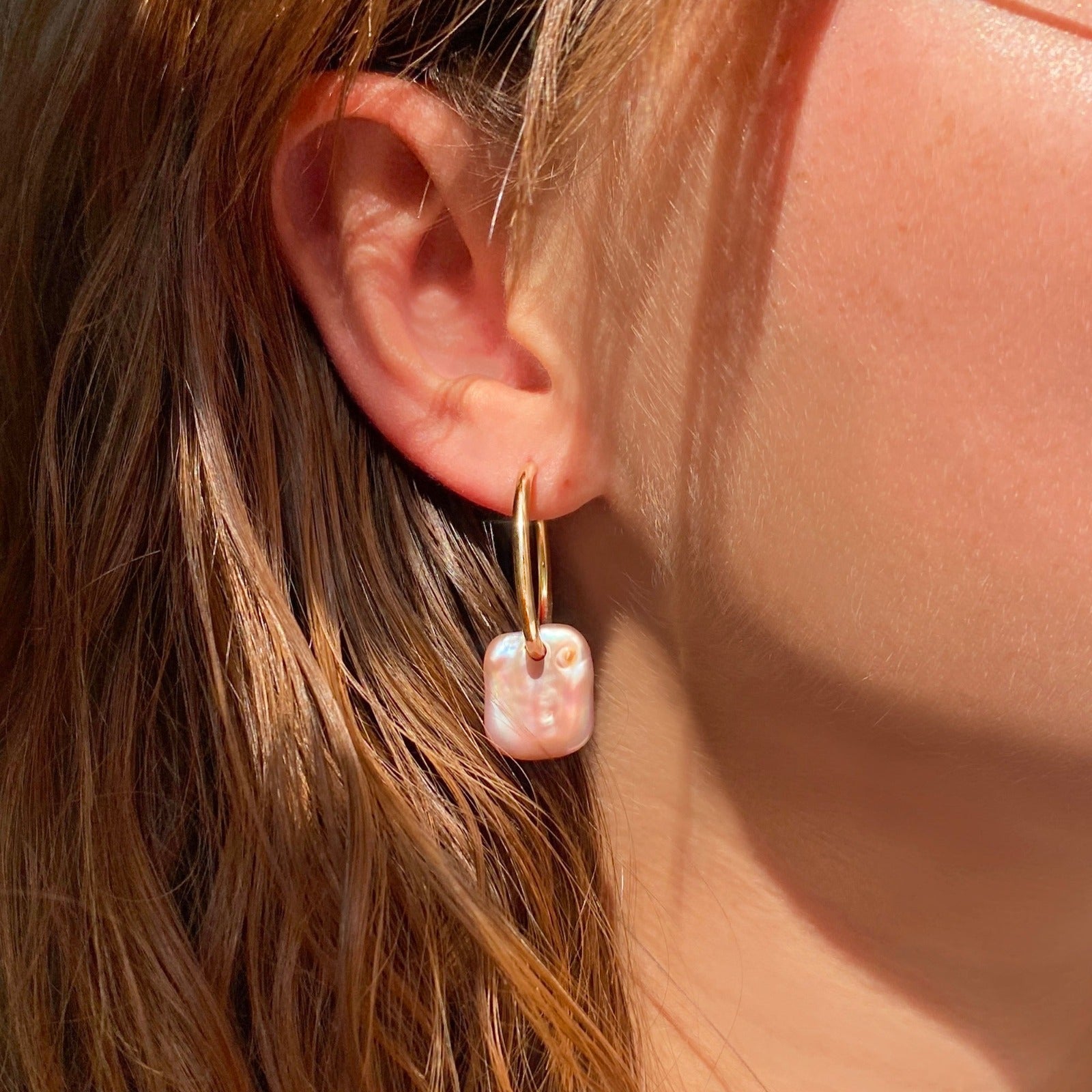 14k recycled gold Pink Rectangular Coin Pearl Hoops on an ear