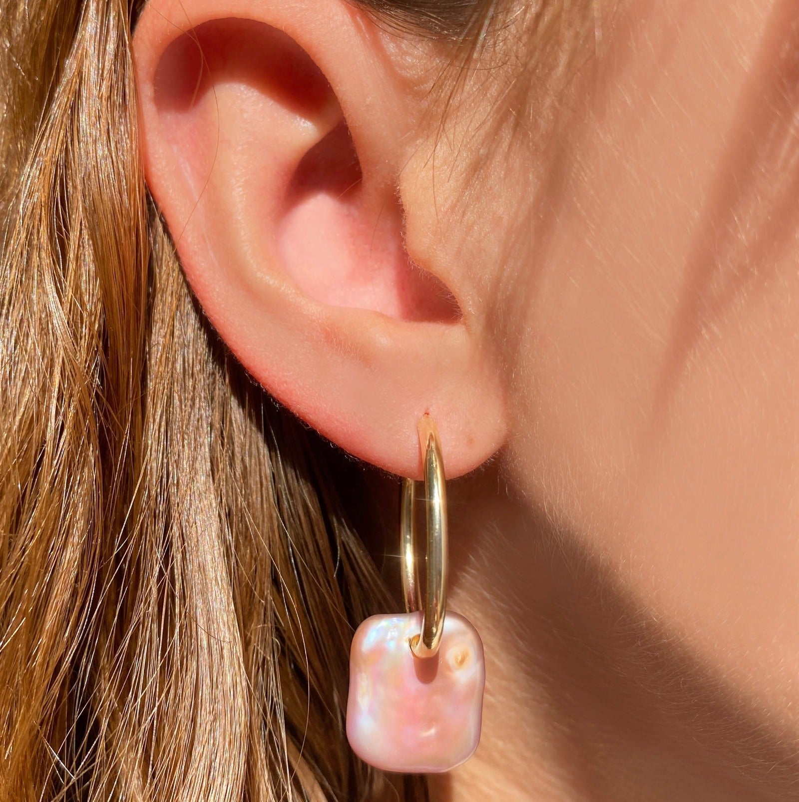 14k recycled gold Pink Rectangular Coin Pearl Hoops on an ear