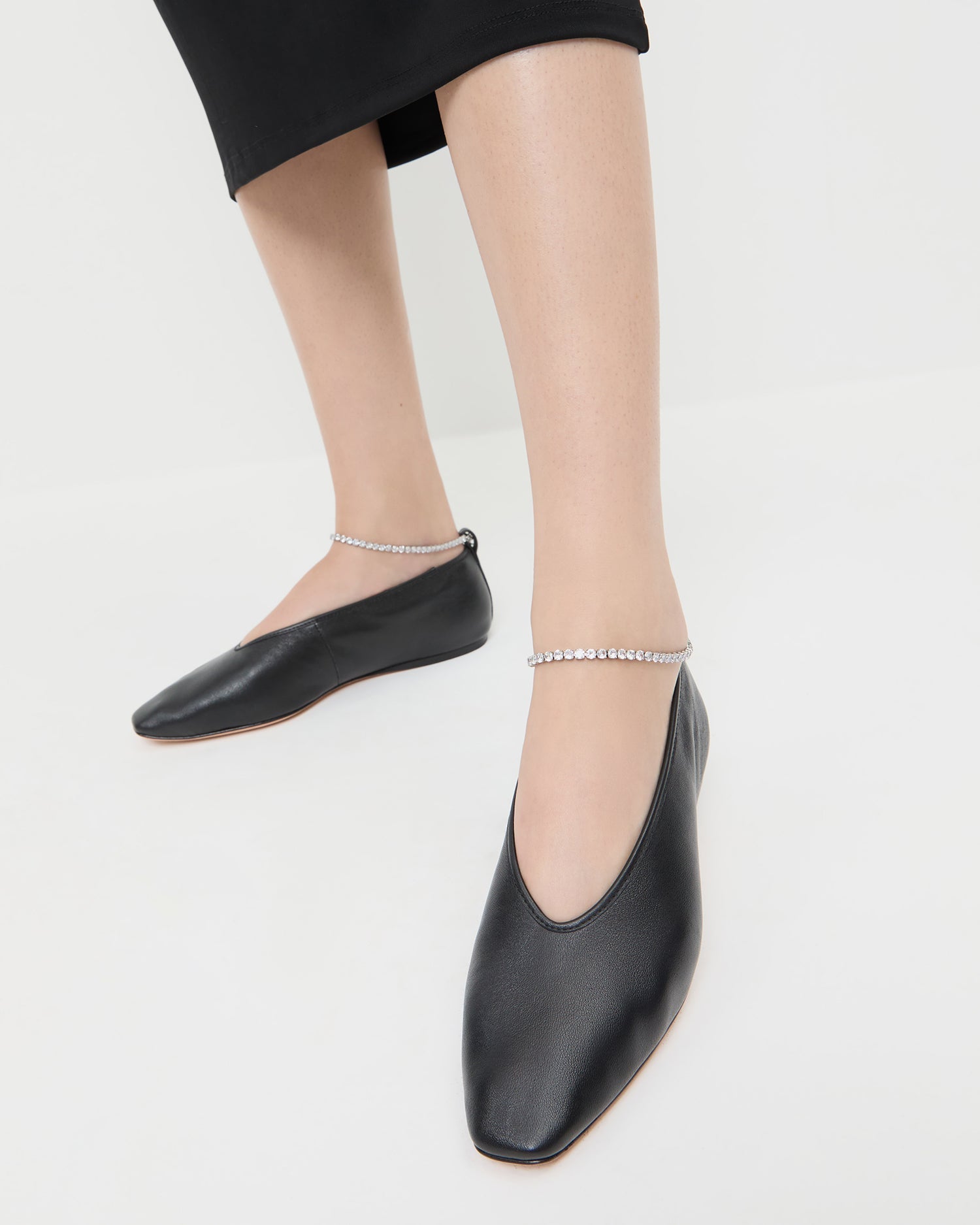 Emery Black/Crystal Ballet Flat in black leather with crystal accents.