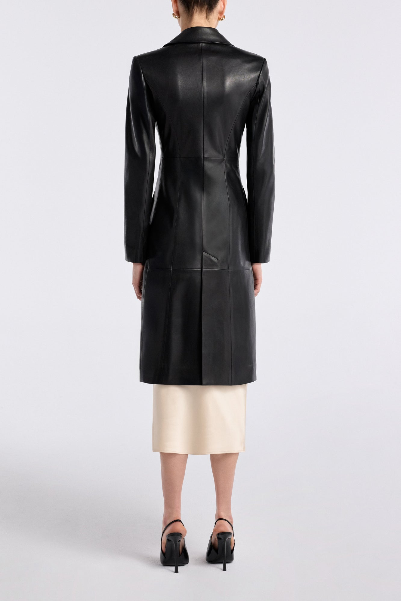 Model is wearing the Nour Hammour Eames Grand Leather Coat Black - Back