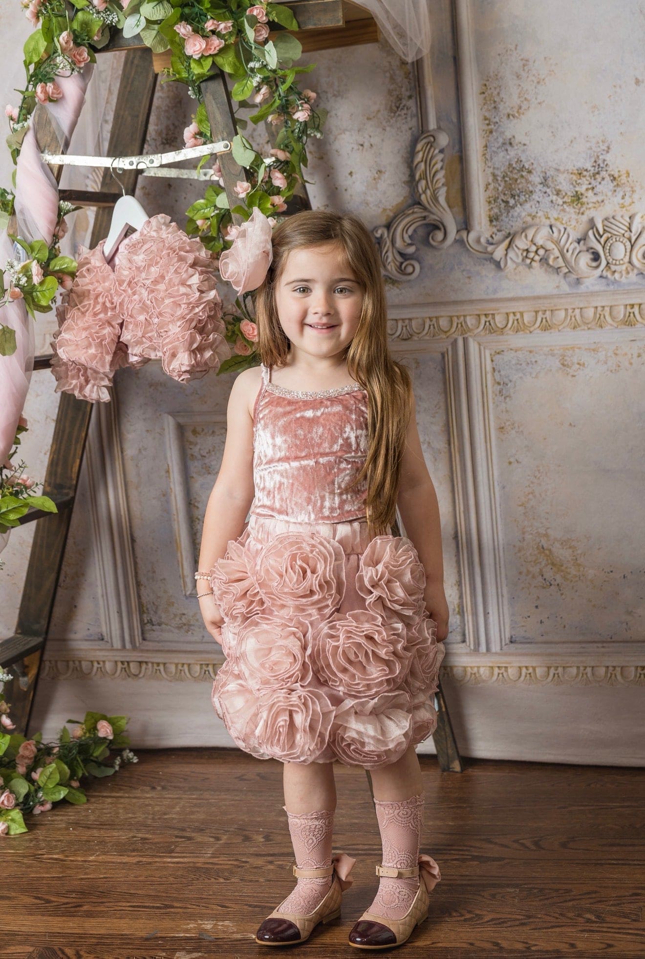 Girls blush pink velvet camisole top paired with matching skirt with flower details