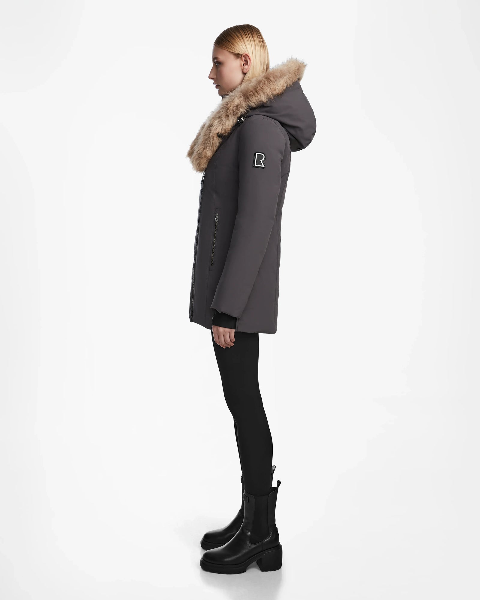 A woman wearing the AURORE - L123561 Grey fitted winter coat by Rudsak.