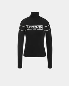 The ERIKA - 8523536 Black by Rudsak is a black turtleneck sweater with long sleeves, white horizontal stripes, and bold APRÈS-SKI RUDSAK lettering—a cozy après-ski piece perfect for your winter wardrobe.