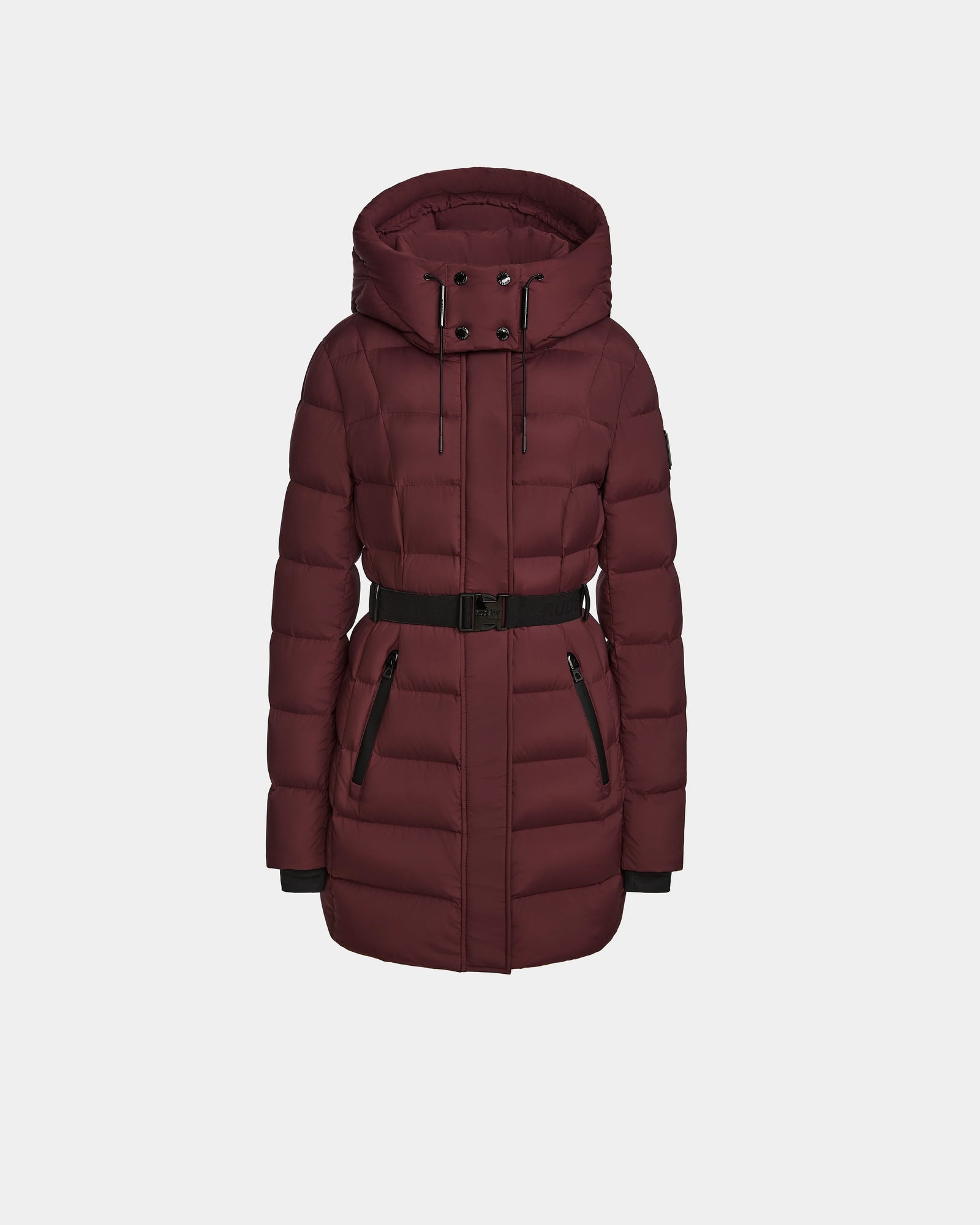The Rudsak FRIDA M - L124524 Wine is a womens mid-length burgundy quilted down jacket with a front zipper, snap buttons, black belted waist, two zippered pockets, and removable hood, shown on a plain white background.