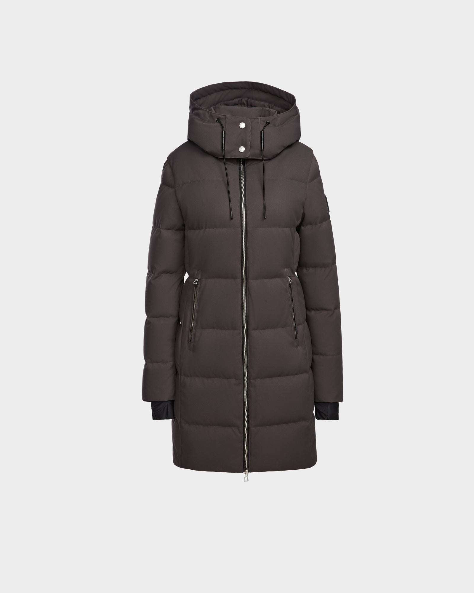 The MIRIAM - L123544 Grey by Rudsak is a womens down puffer coat in grey, featuring a hood, front zipper, zippered side pockets, and black drawstrings. Its weather-resistant shell is perfect for winter. Displayed on a plain white background.