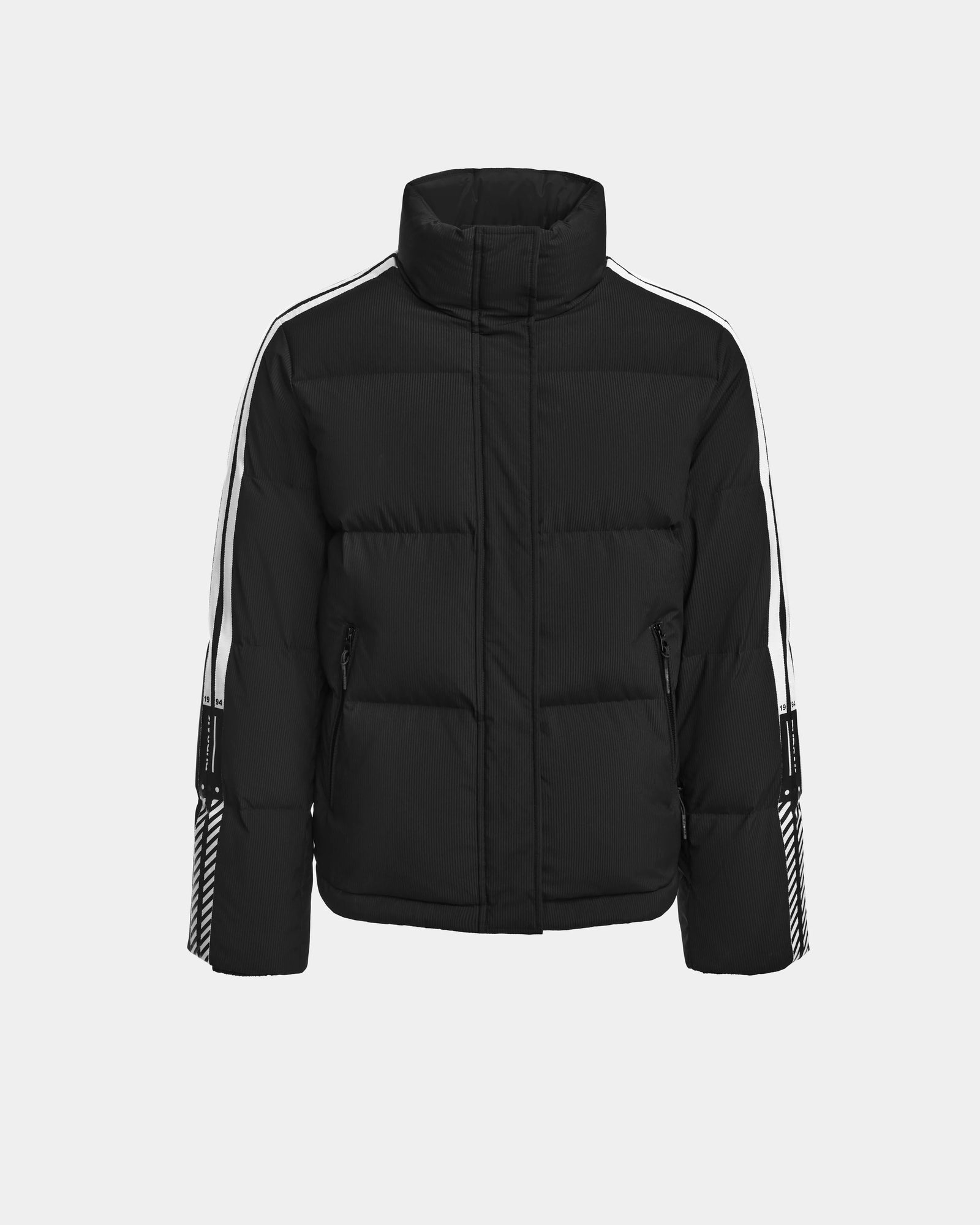 The Rudsak USHER - 6124516 Black men’s down ski jacket features a high collar, white sleeve stripes, zippered pockets, and chevron detailing on the lower sleeves, shown against a plain white background.