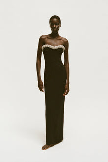 Black strapless floor-length gown with crystal embellishments along the neckline.