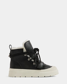 The Rudsak ALEXEY L - L225518 Black is a black high-top sneaker with a thick white rubber sole, lace-up front with metal eyelets, and cozy wool lining—ideal as a winter boot—shown on a plain white background.