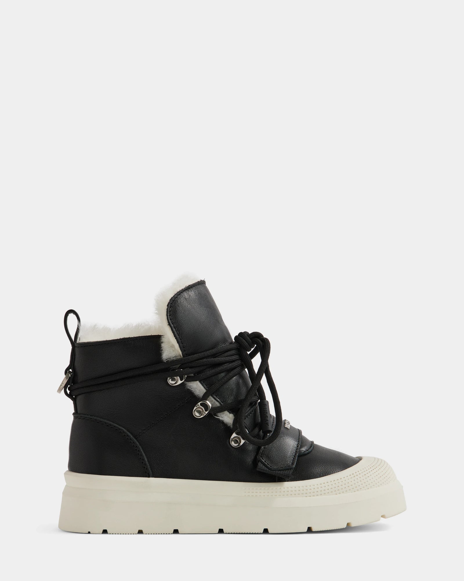 The Rudsak ALEXEY L - L225518 Black is a black high-top sneaker with a thick white rubber sole, lace-up front with metal eyelets, and cozy wool lining—ideal as a winter boot—shown on a plain white background.
