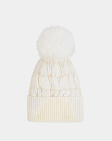 The LANYA - L423514 Iceland by Rudsak is a cream wool-blend knit women’s beanie with a ribbed cuff and large pom-pom, shown against a plain white background.
