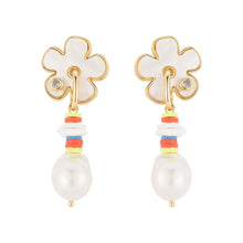 Flower and Multi Bead Pearl Drop Earrings on Flat White Background