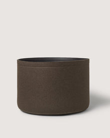 A round brown fabric storage basket by Graf Lantz, featuring smooth sides and an open top, displayed against a plain light background.