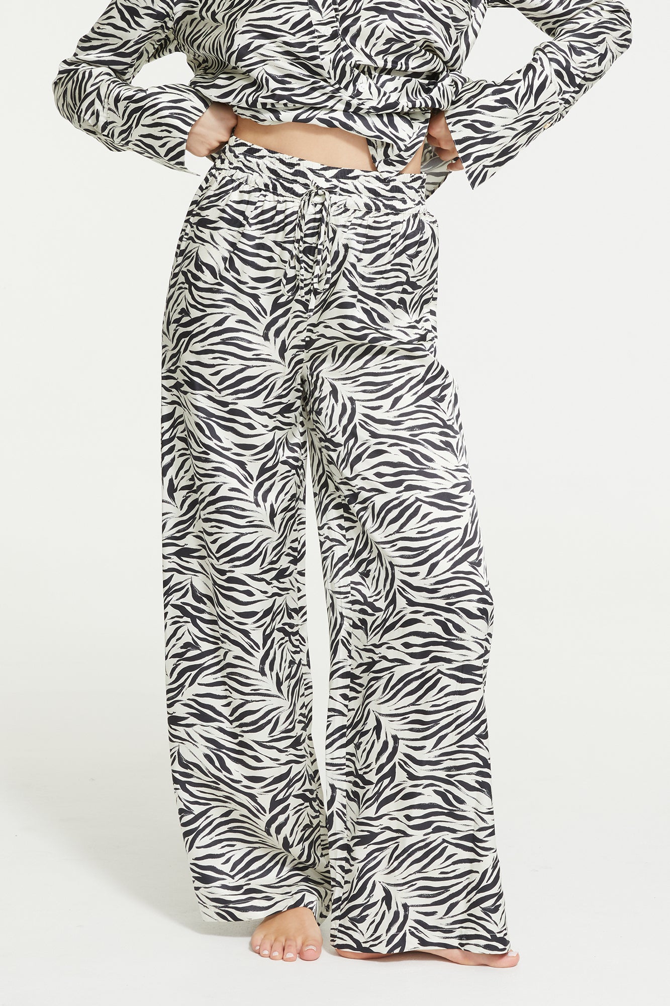 The Zafina Long Pants in Brush Zebra Print by Ginia