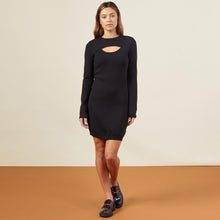 Front view of model wearing the supersoft sweater knit cut out dress in black.