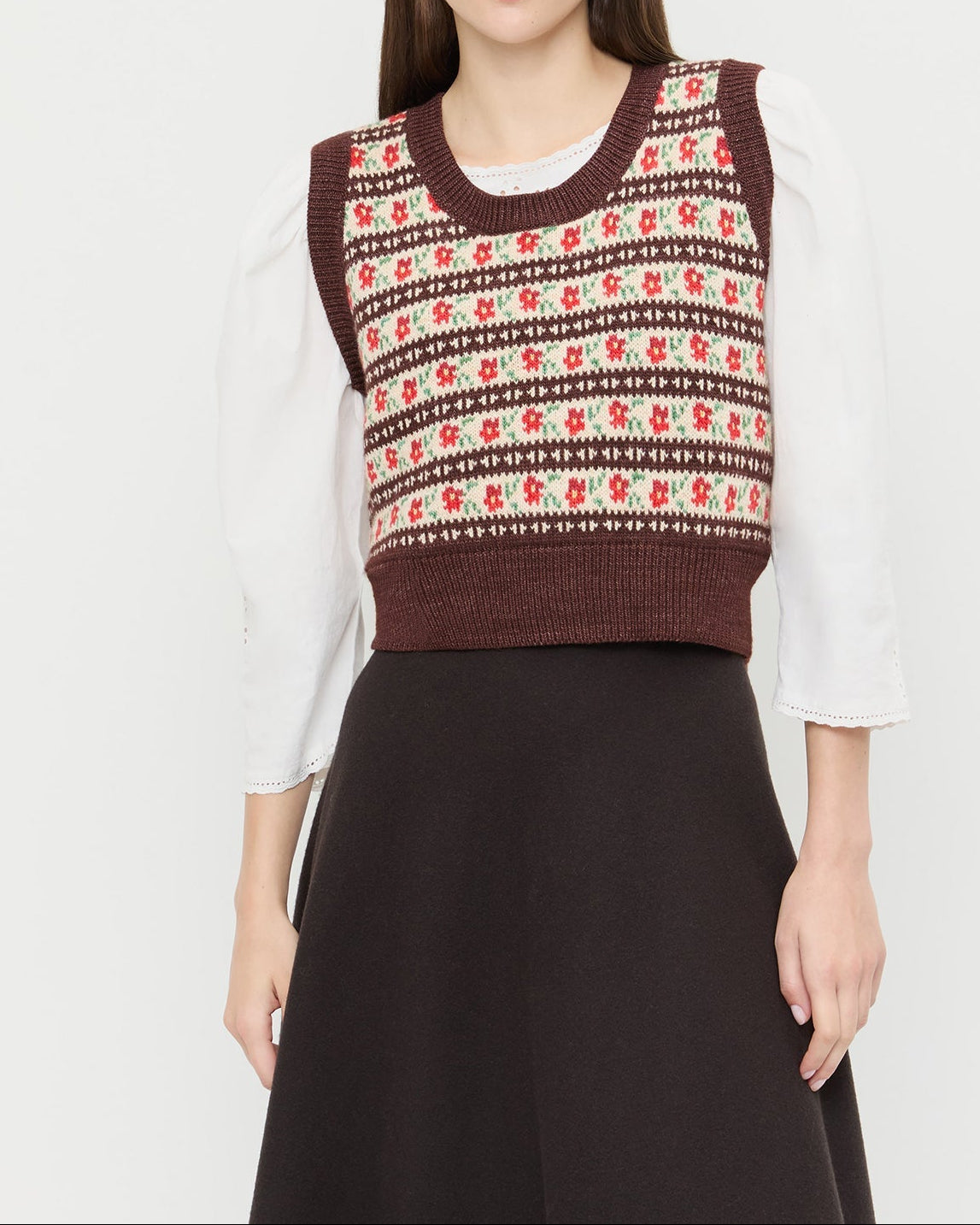 Heather Sweater Vest in brown and red intarsia floral, Felicity Blouse in cream cotton, and Tansy Suede Skirt in brown suede.