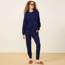 Front view of model wearing the supersoft fleece slouchy pullover in navy.