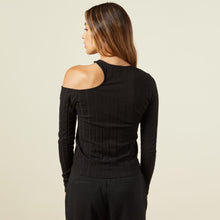 Back view of model wearing the flat rib asymmetric long sleeve in black.