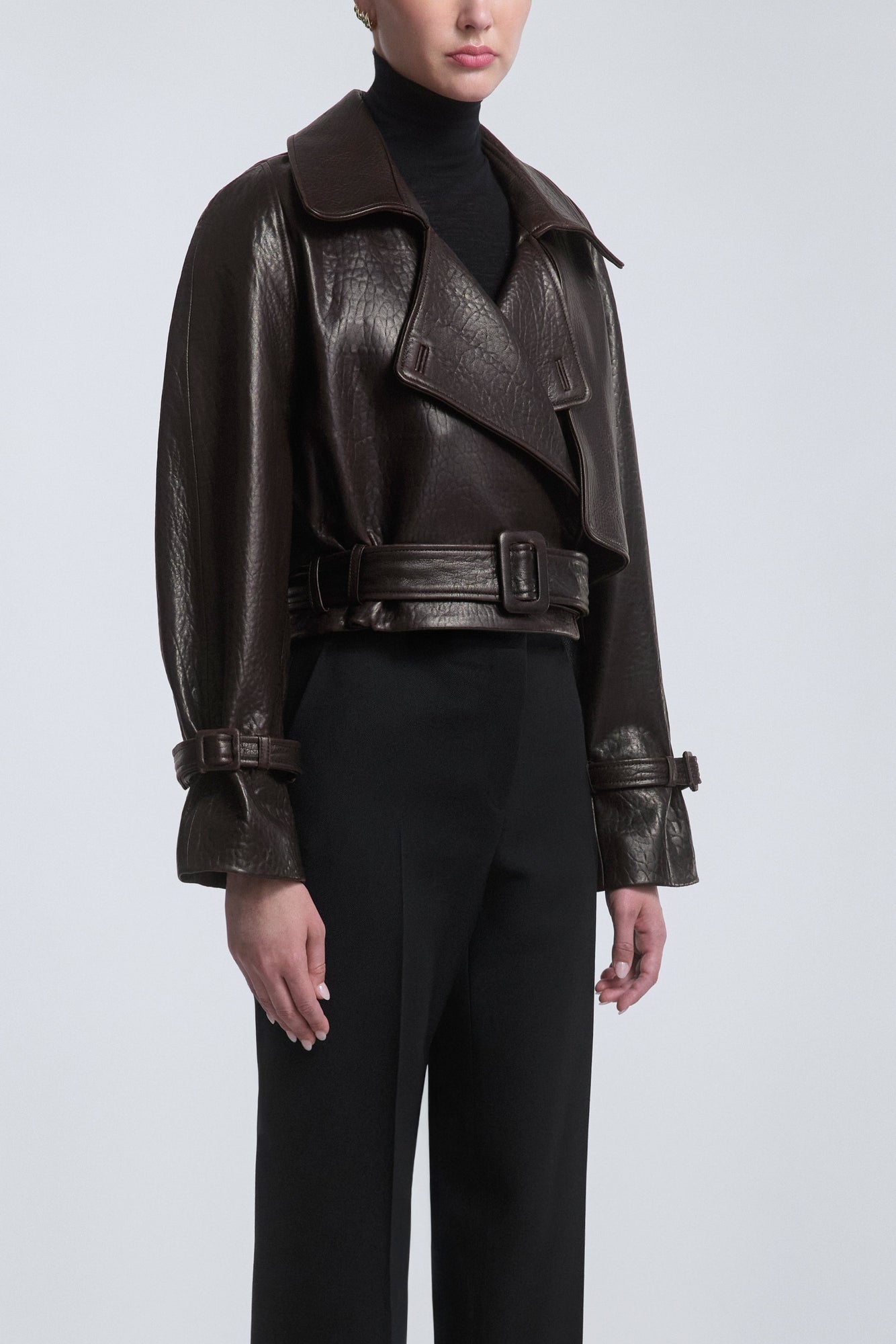 Model is Wearing the Nour Hammour Hatti Cropped Leather Jacket Rich Brown - Three Quarters