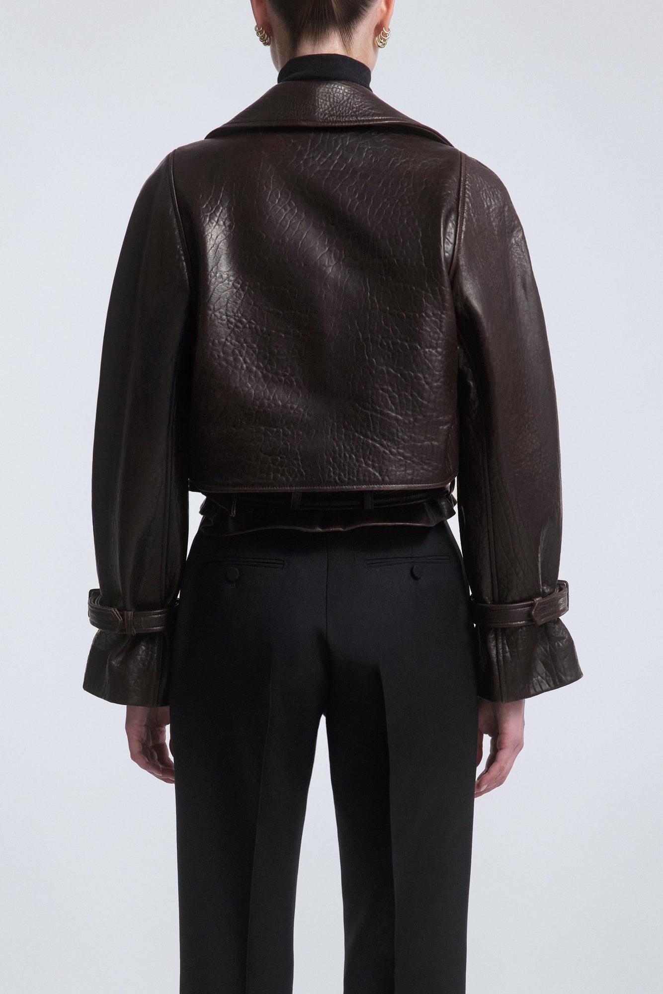 Model is Wearing the Nour Hammour Hatti Cropped Leather Jacket Rich Brown - Back