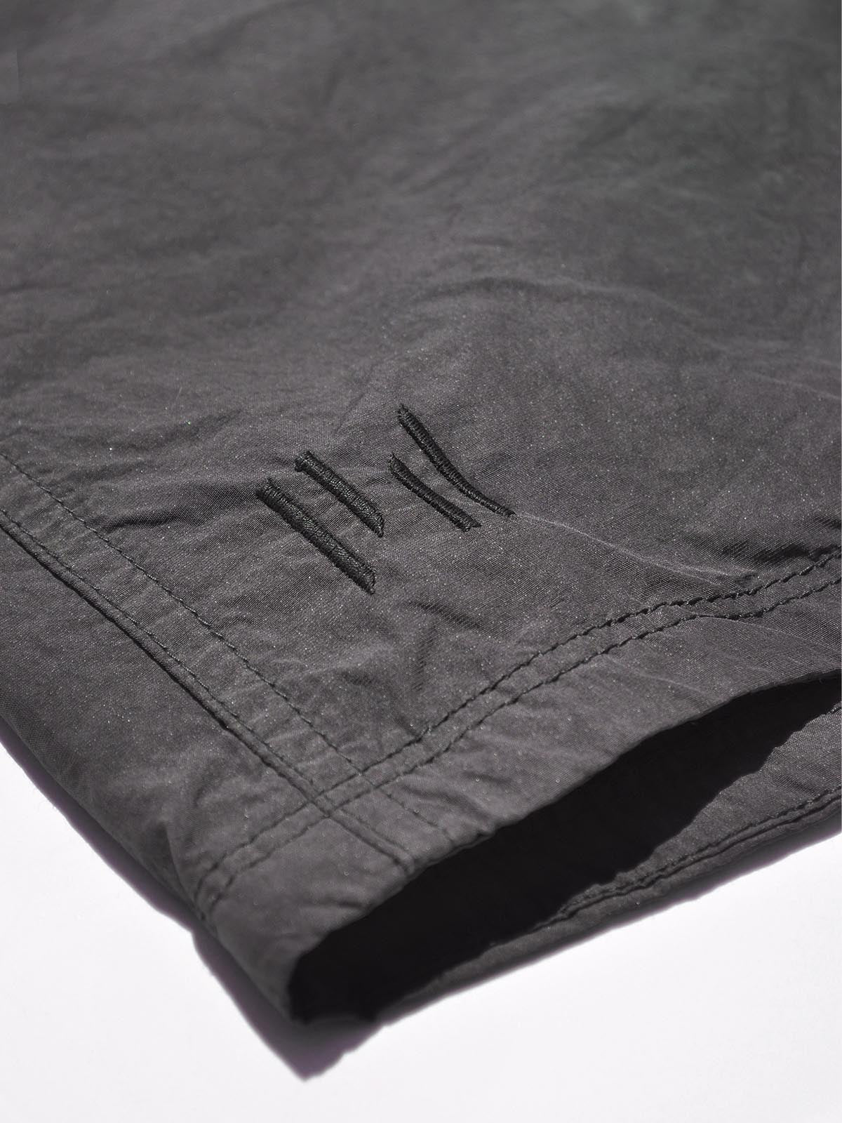 Man Hybrid Trunk - Floral Camo - logo detail